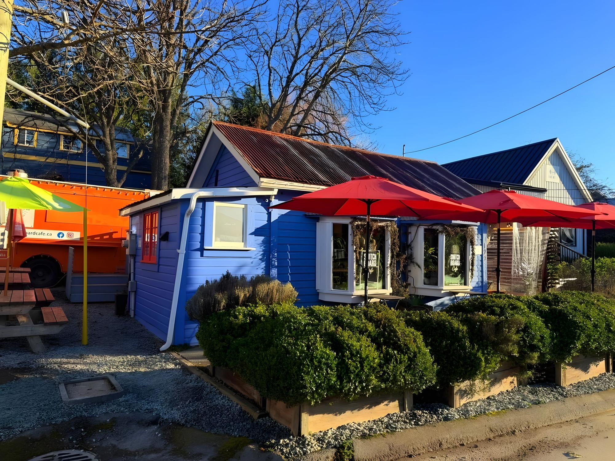 Switchboard Cafe: the blue cottage with red umbrellas on Hereford Avenue